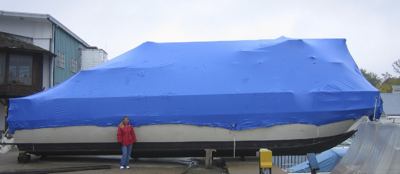 A shrink wrapped houseboat, ready for the winter storage season.