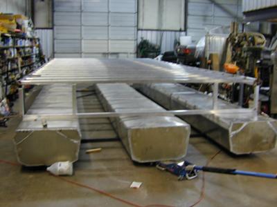 Aluminum pontoons, and the houseboat superstructure framing.
