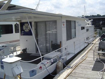 Do you repair or replace a leaking houseboat roof.
