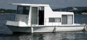 A clean looking Fisher Craft houseboat.