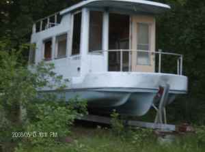 Any ideas as to who built these trailerable houseboats?