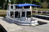 Bow view of a trailerable Nomad houseboat