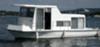 A clean looking Fisher Craft houseboat.