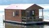 A sampling of a floating cabin style houseboat.