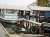 Houseboat coming out of the water for the winter.